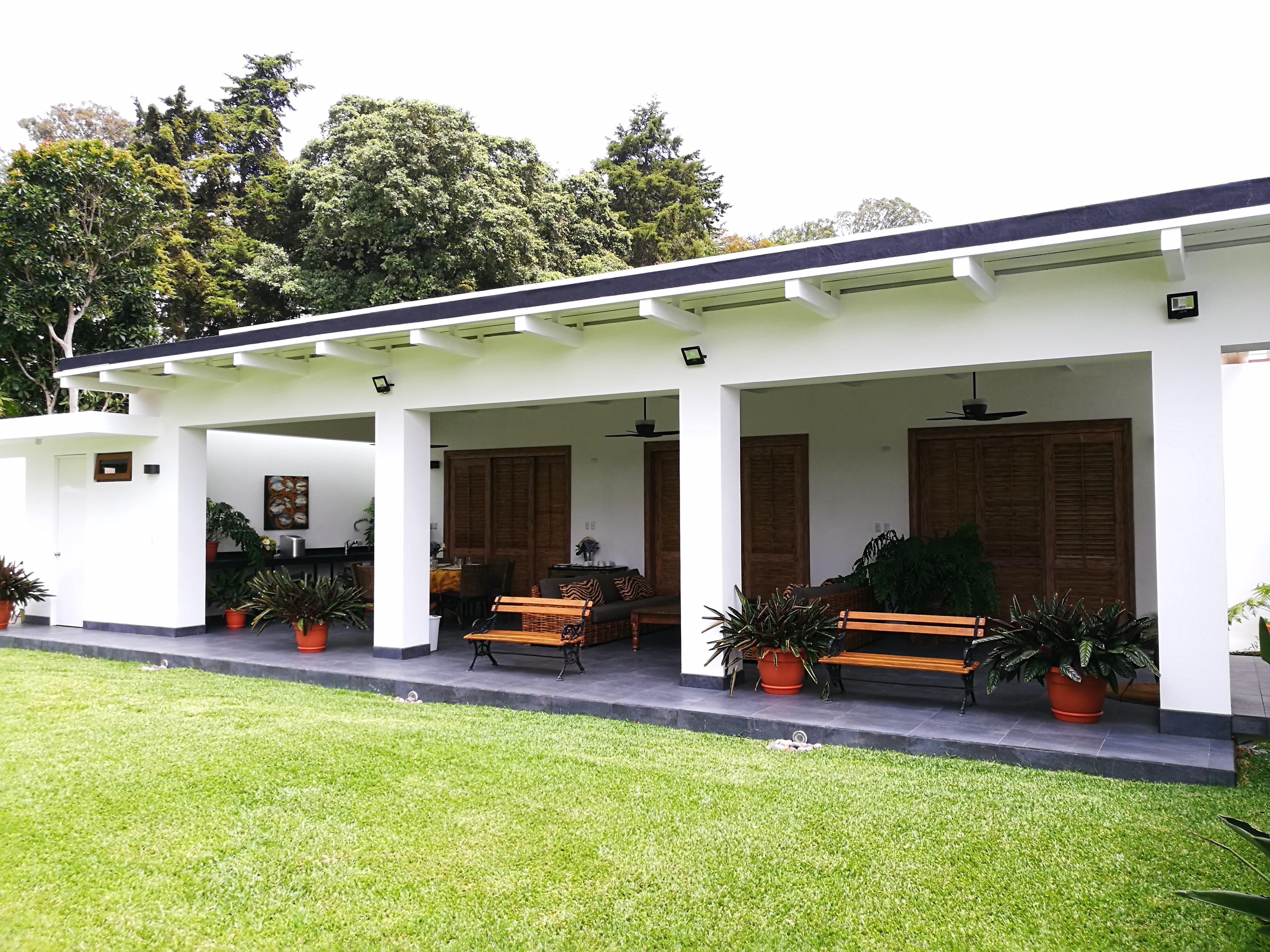 Refreshing a home with innovative additions, garage and pergola